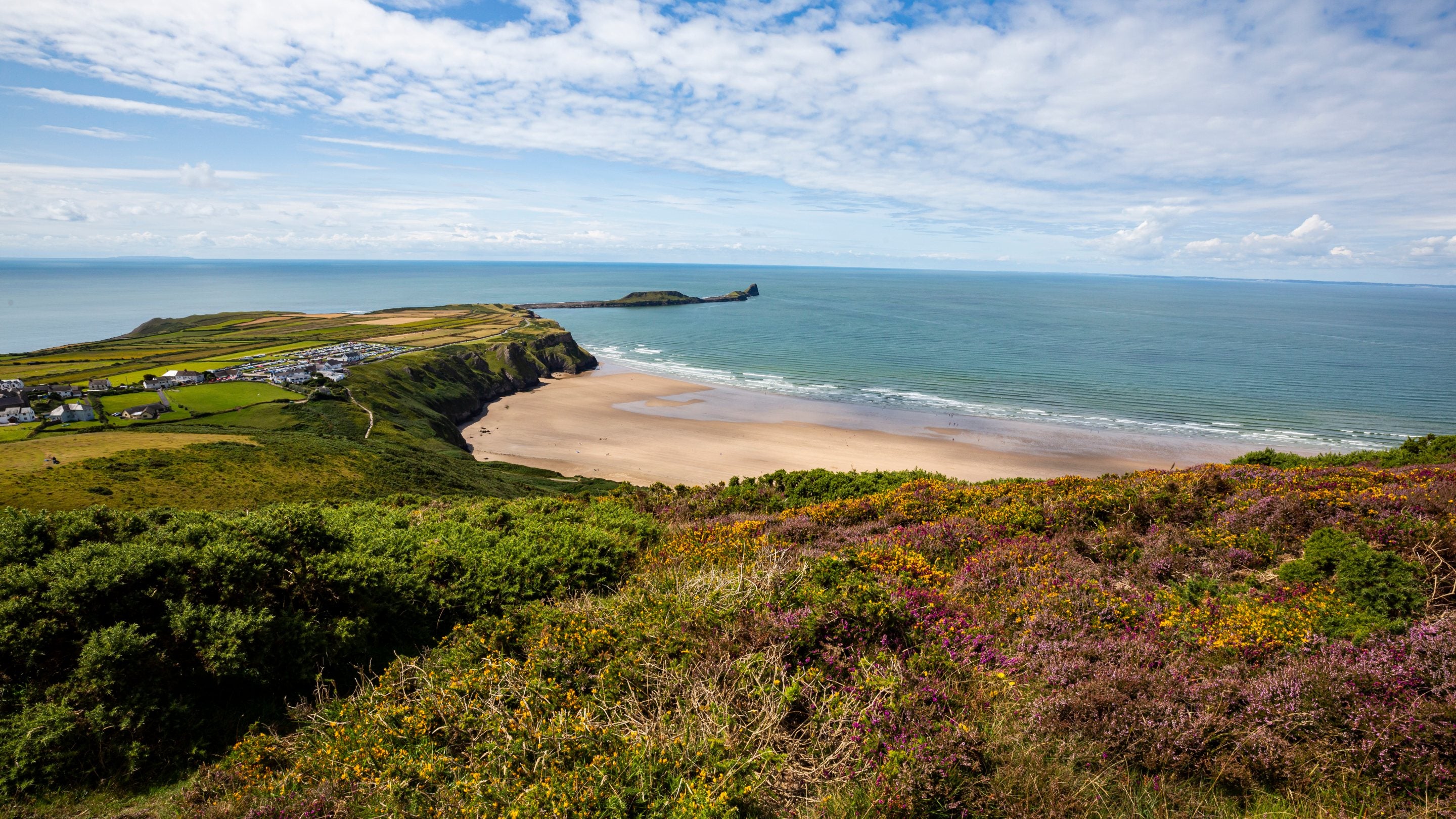 Picture of a hillside view with a beach in the background